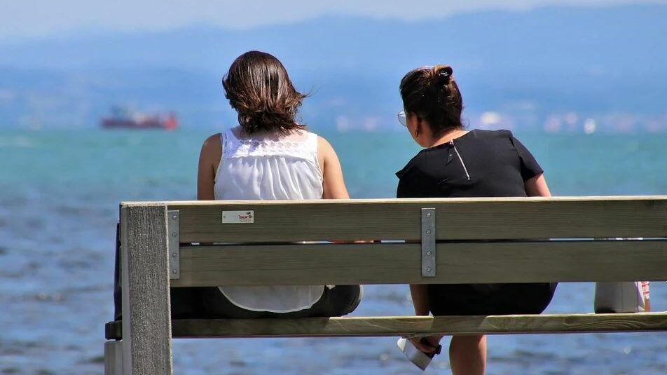 two girls on a bench