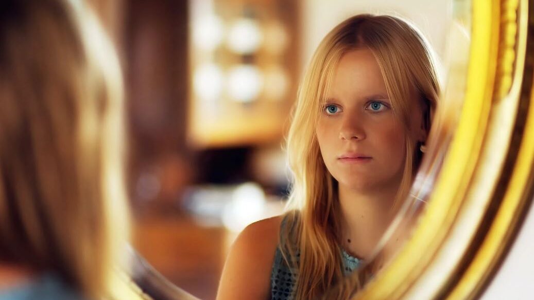 a woman front of a miror