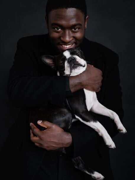 a black guy with a dog