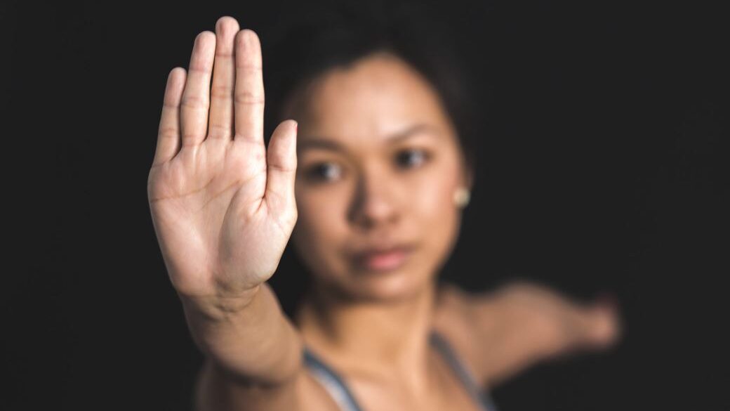 a woman making a stop with her hand