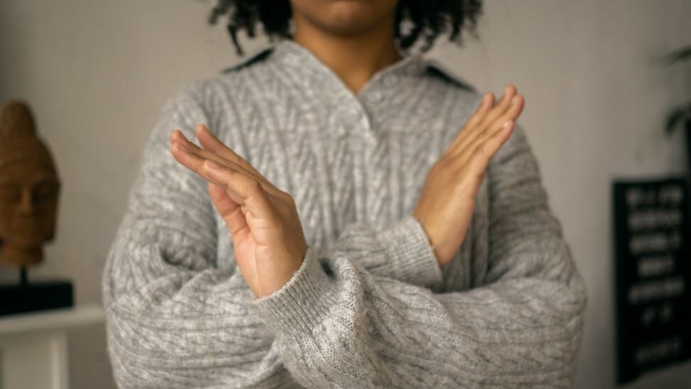 a woman making a stop with her hands