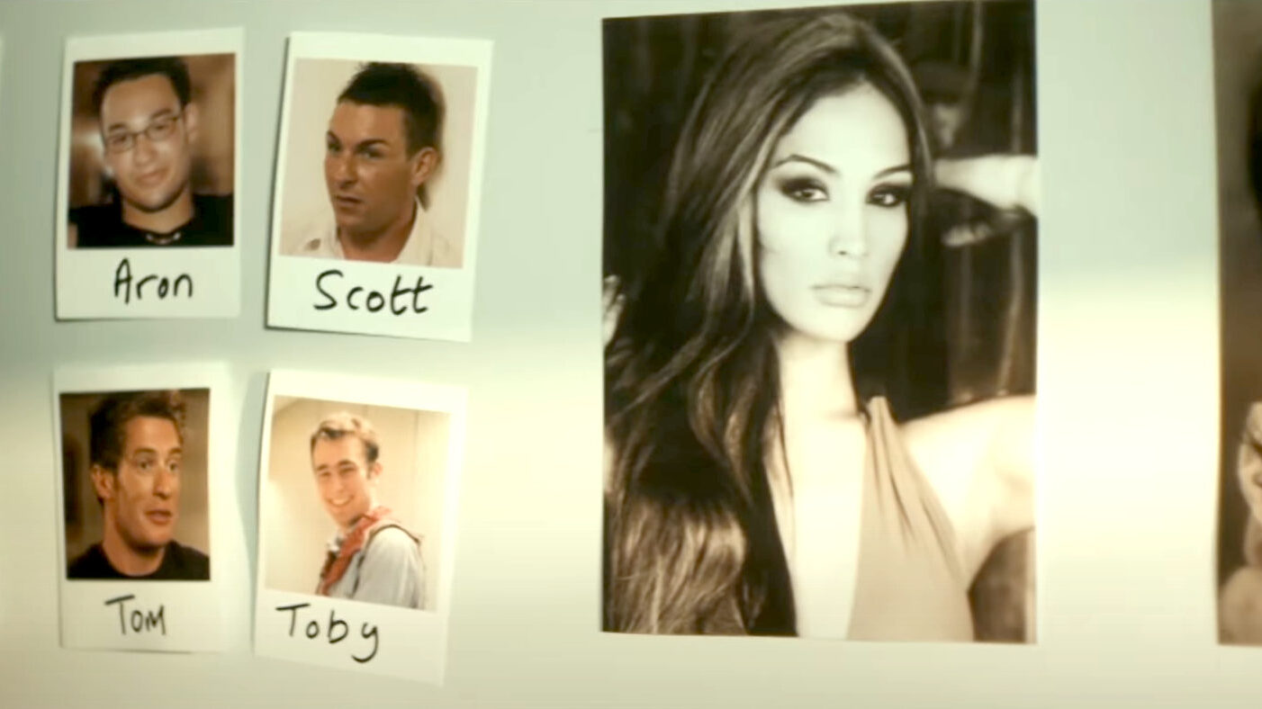 A wall display featuring a black-and-white portrait of Miriam Rivera alongside polaroid photos of contestants labeled Aron, Scott, Tom, and Toby, from Miriam: Death of a Reality Star.