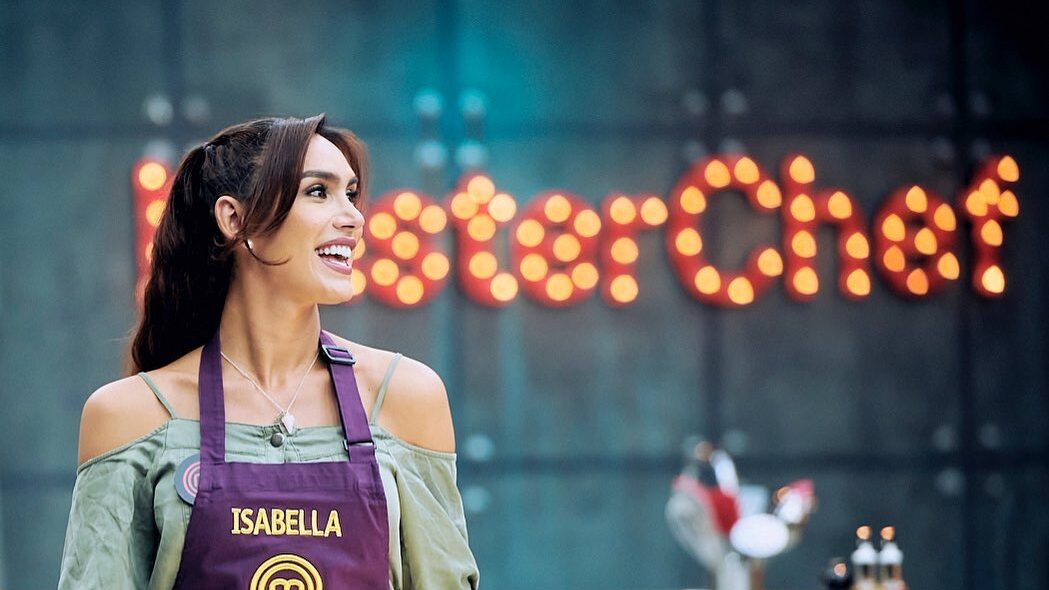 Isabella Santiago smiles in her apron during a MasterChef episode.