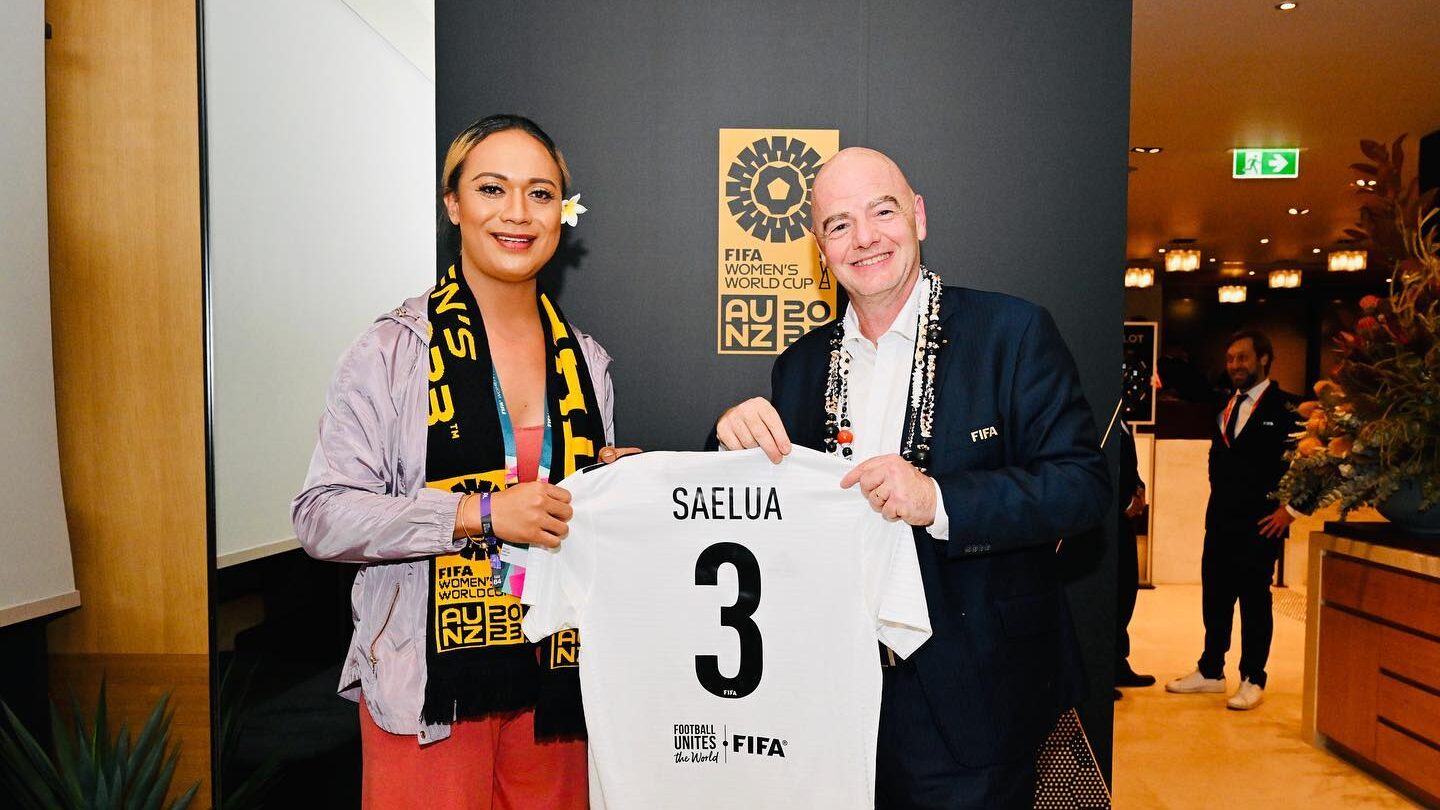 Jaiyah Saelua holding a FIFA jersey with Infantino in Sydney after 2023 FIFA Women’s World Cup.