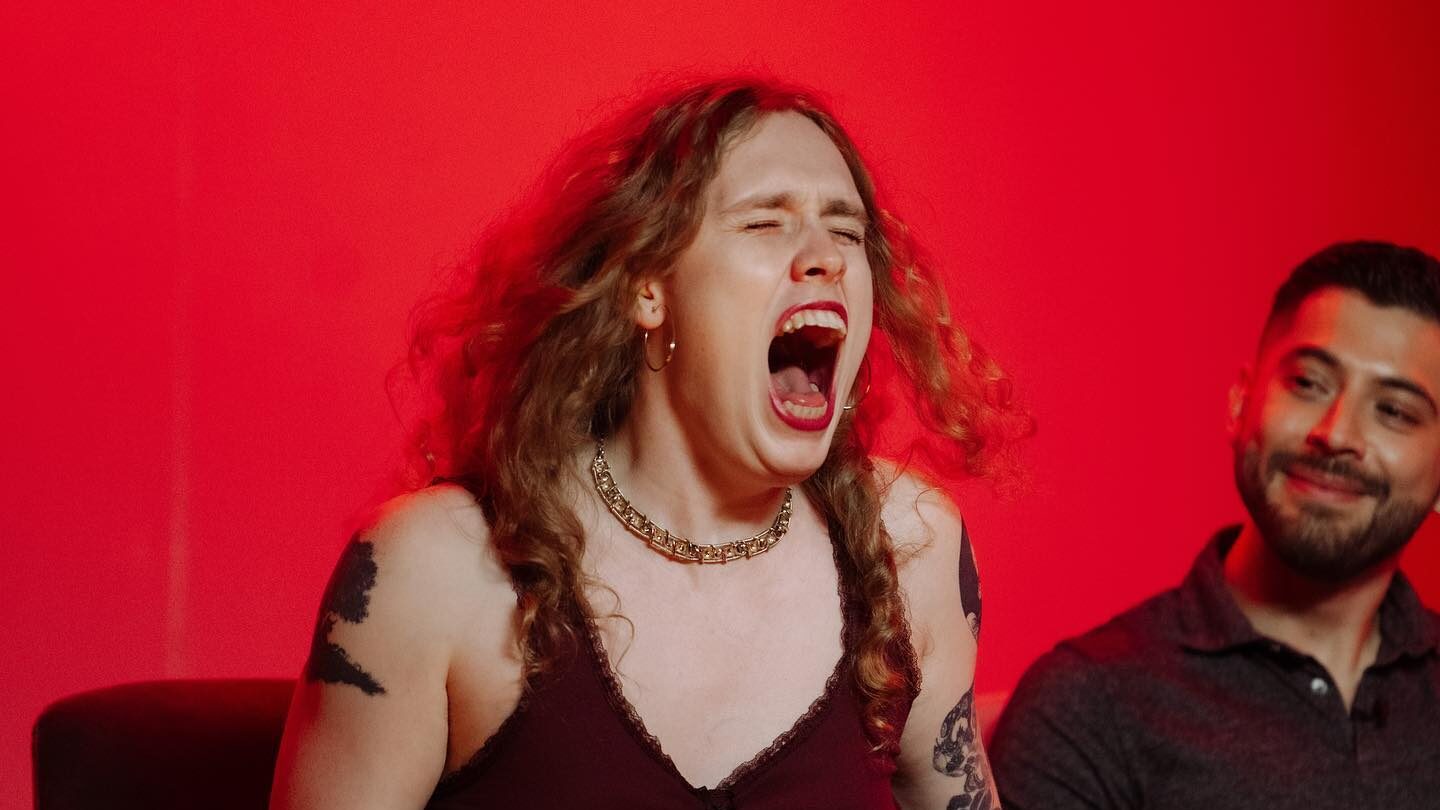 Close-up of Sunny L expressing intensely during a stand-up performance.