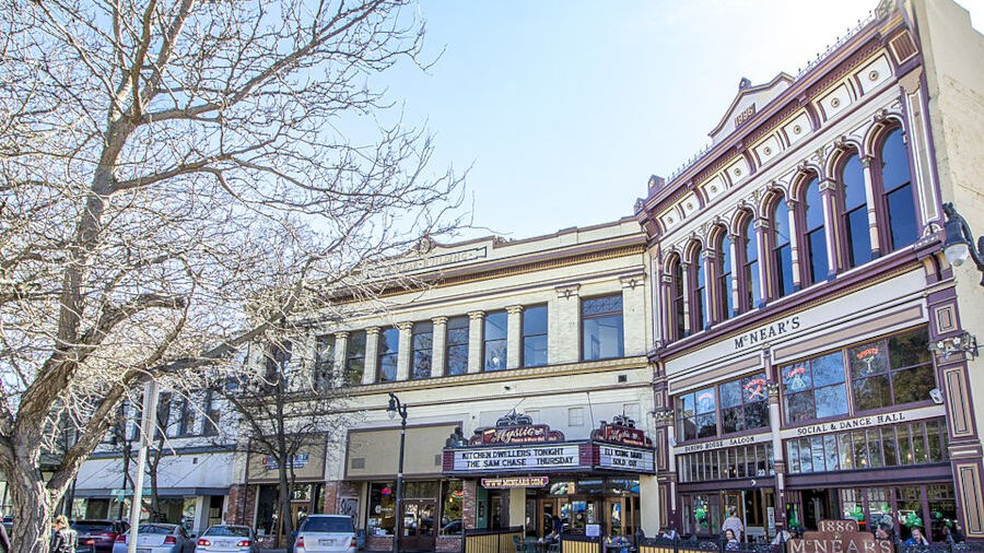 Wide-angle view of McNear’s Saloon and Mystic Theatre in Petaluma’s historic downtown district, photographed in daylight.