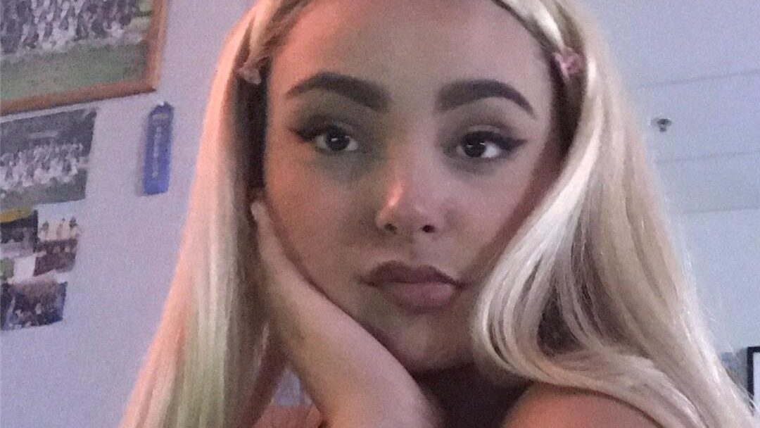 2018 image of young Zoey Luna with thick eyebrows and long blonde hair, gazing into the camera.