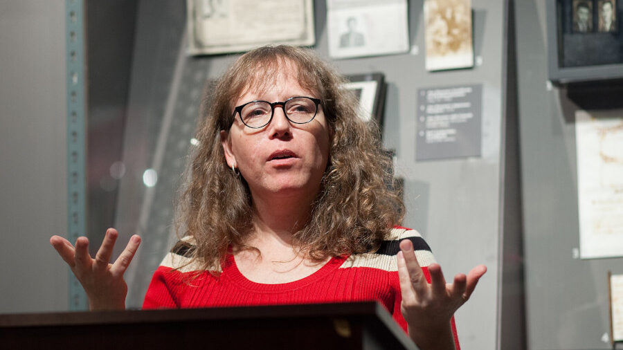 Julia Serano speaking at a podium at the GLBT History Museum in San Francisco during the launch of Whipping Girl.