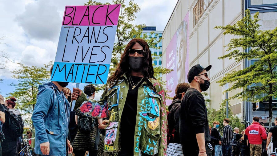 Honey Dijon stands among demonstrators at Alexanderplatz in Berlin during a Black Trans Lives Matter protest.