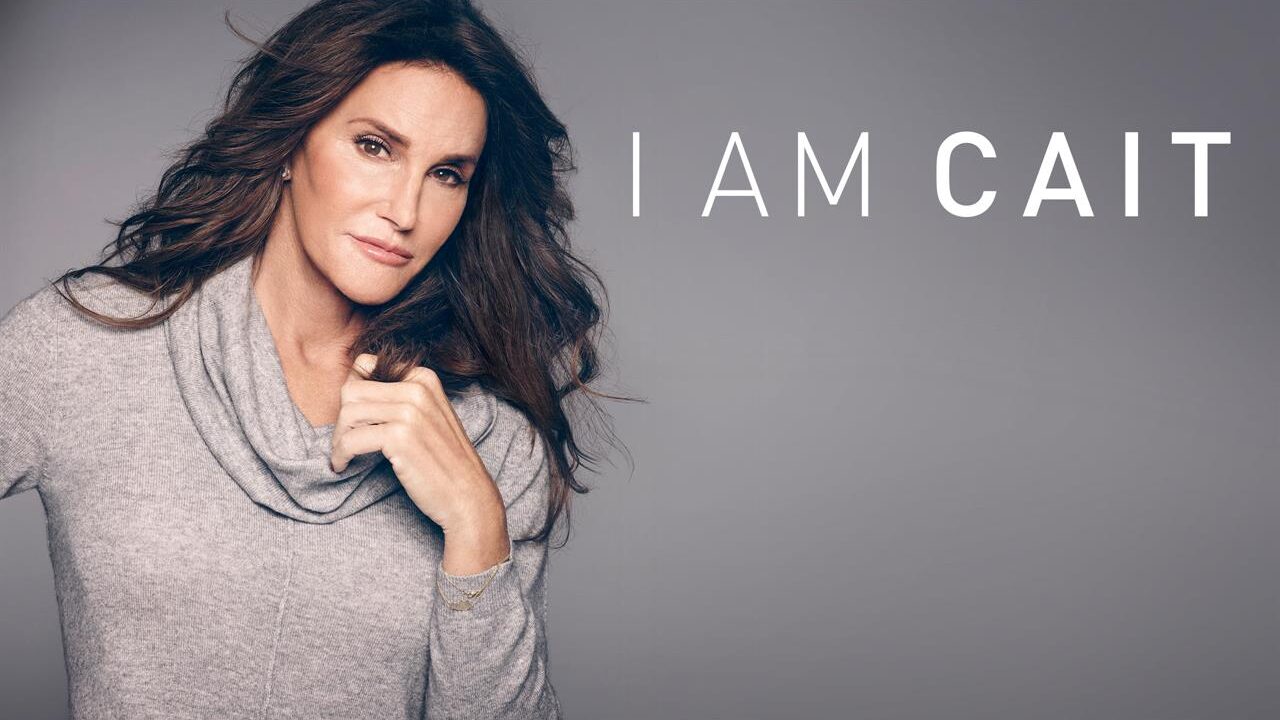 Promotional artwork for I Am Cait featuring Caitlyn Jenner wearing a light gray sweater against a gray background, with the series title displayed on the right.