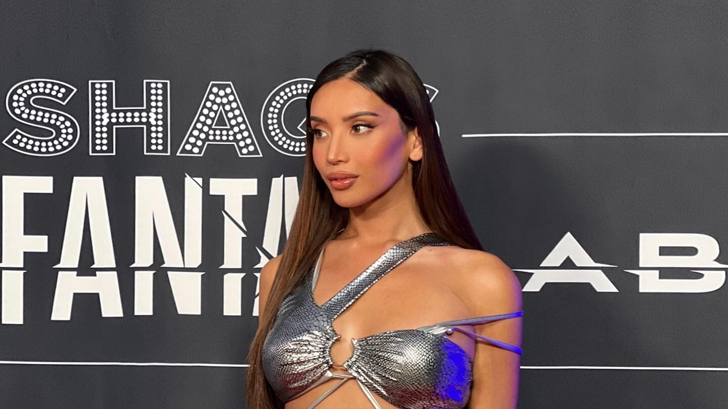 Kataluna Enriquez poses on the Shaq’s Fantasy Lab red carpet wearing a silver futuristic outfit in Las Vegas in 2023.
