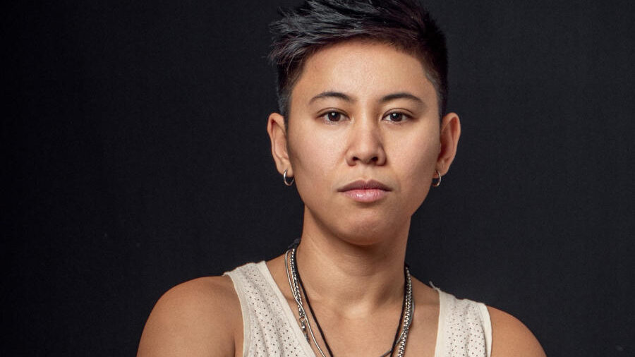 Choreographer and dancer Makisig Akin photographed against a black studio background.
